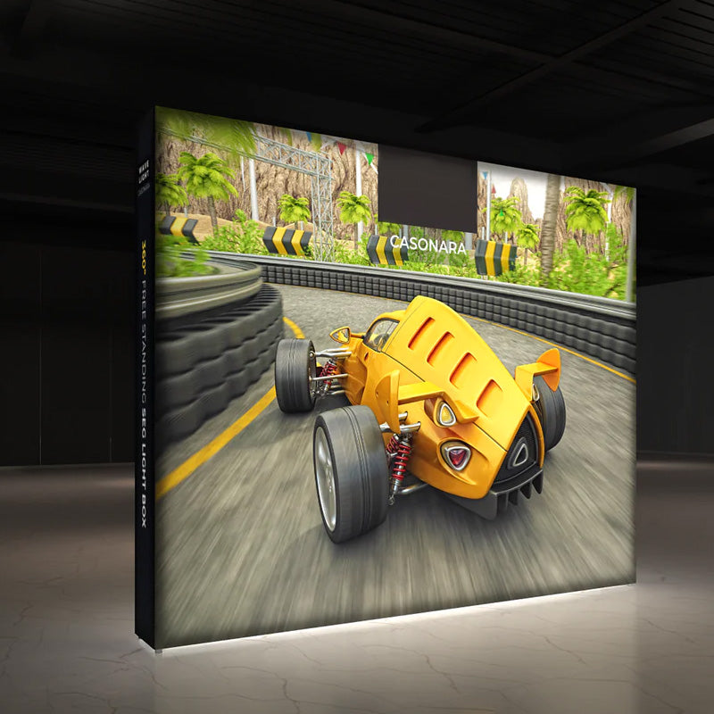 Night view of the 10ft backlit SEG pop up display featuring a bright, edge-to-edge illuminated tension fabric graphic.