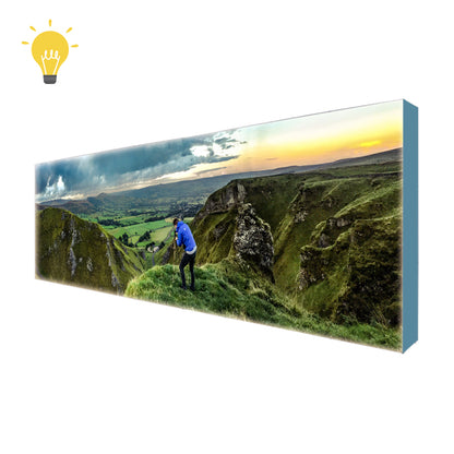 Front view of the massive 20ft backlit SEG pop up display featuring a bright, edge-to-edge illuminated tension fabric backwall.