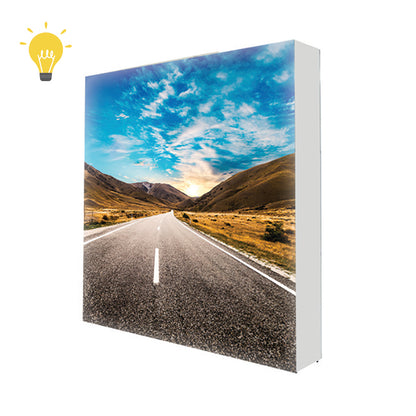 Front view of the 7.5ft backlit SEG pop up display featuring a bright, edge-to-edge illuminated tension fabric backwall.