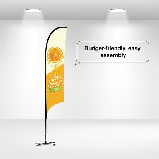 A promotional flag banner set up indoors, featuring a yellow and black flag with a custom printed design, mounted on a pole with a cross base and ground stake.