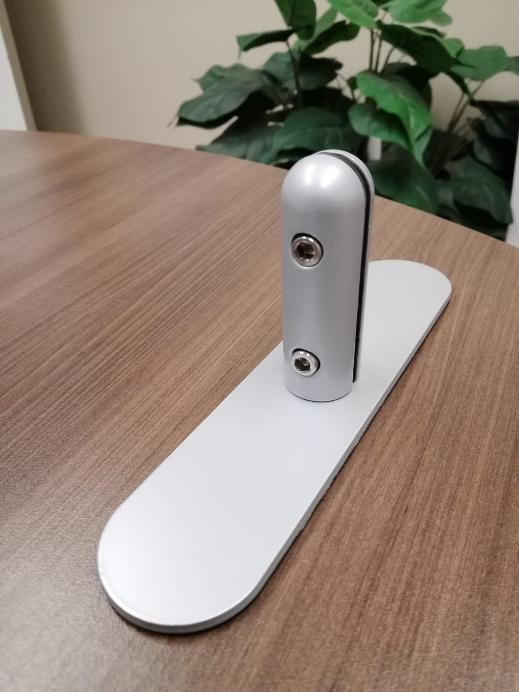 Metal hardware table stand from Artsoft Expo Solutions Inc., showcasing a sturdy mounting bracket for display or signage support.