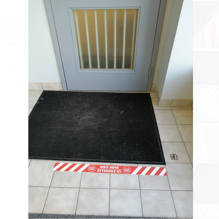 Artsoft Expo 32x2.5 inch floor strip sticker with STOP / WAIT HERE message for guiding foot traffic on floors.
