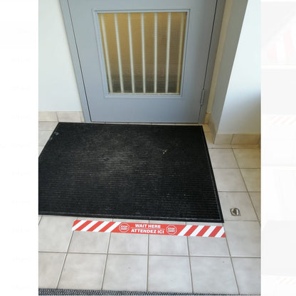 Artsoft Expo 32x2.5 inch floor strip sticker with STOP / WAIT HERE message for guiding foot traffic on floors.
