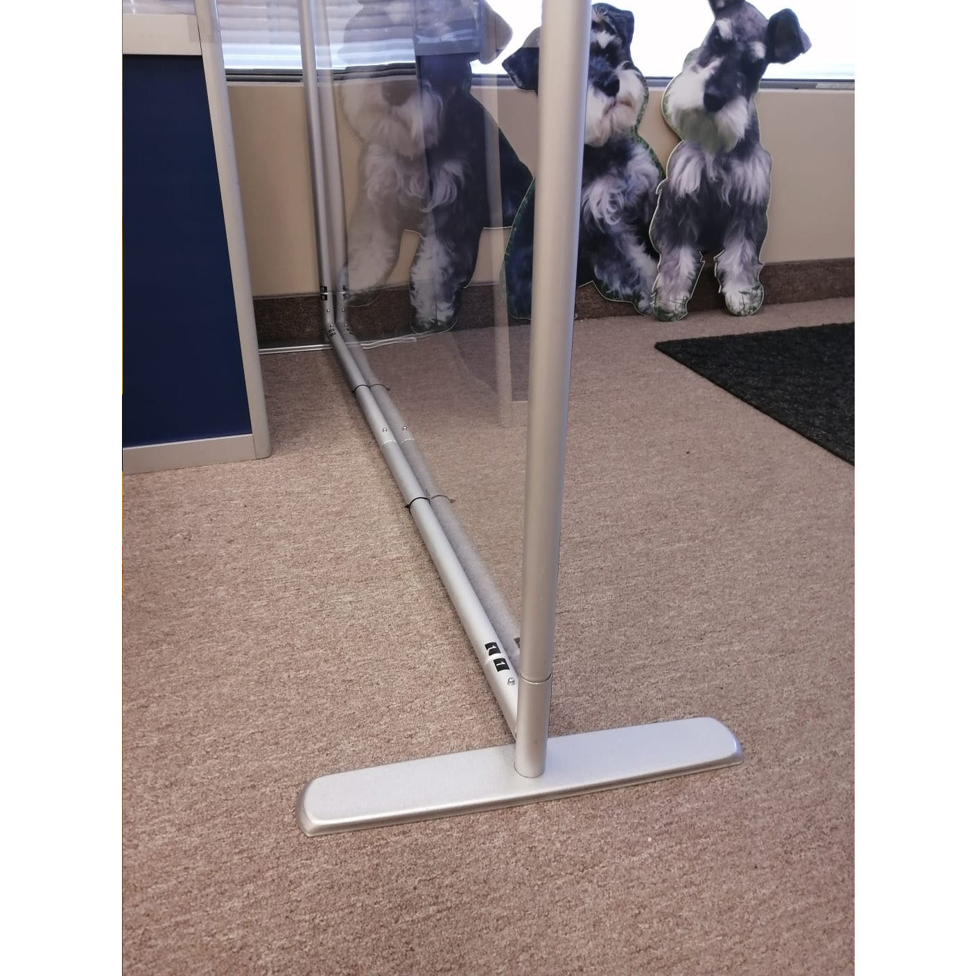 Portable Protective Screen II by Artsoft Expo Solutions Inc. with clear acrylic panels and metal frame for safety and privacy.