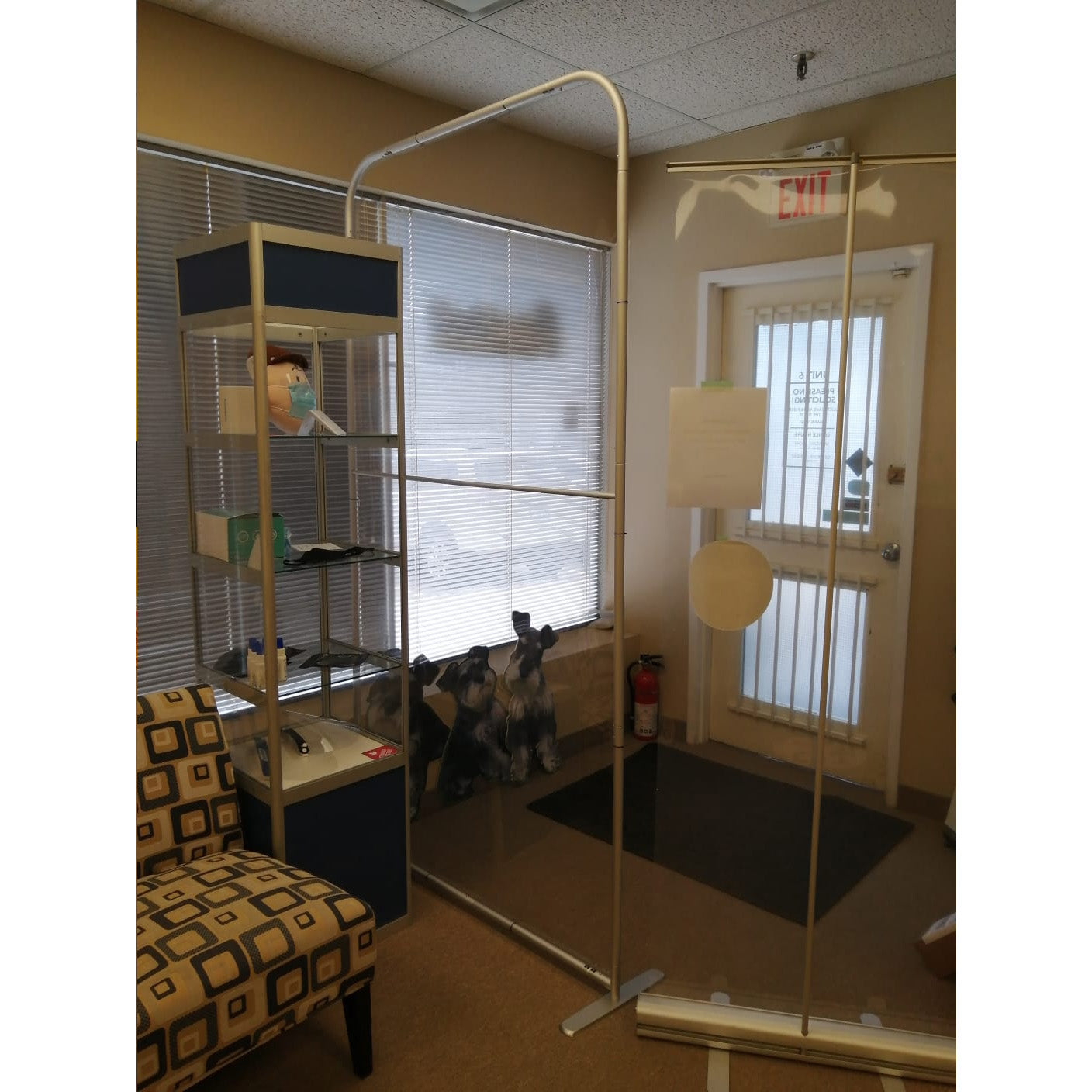 Portable Protective Screen II by Artsoft Expo Solutions Inc., clear plastic barrier with metal frame for safety and social distancing.