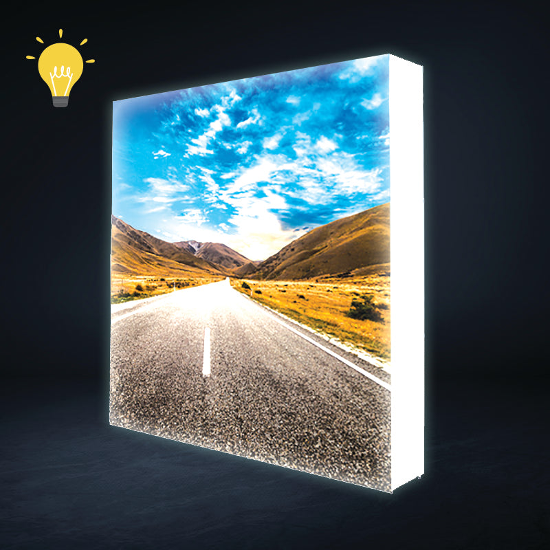 Front night view of the 7.5ft backlit SEG pop up display featuring a bright, edge-to-edge illuminated tension fabric backwall.