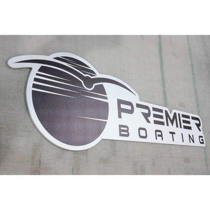 Custom contour-cut business signage ready for mounting at a corporate event.